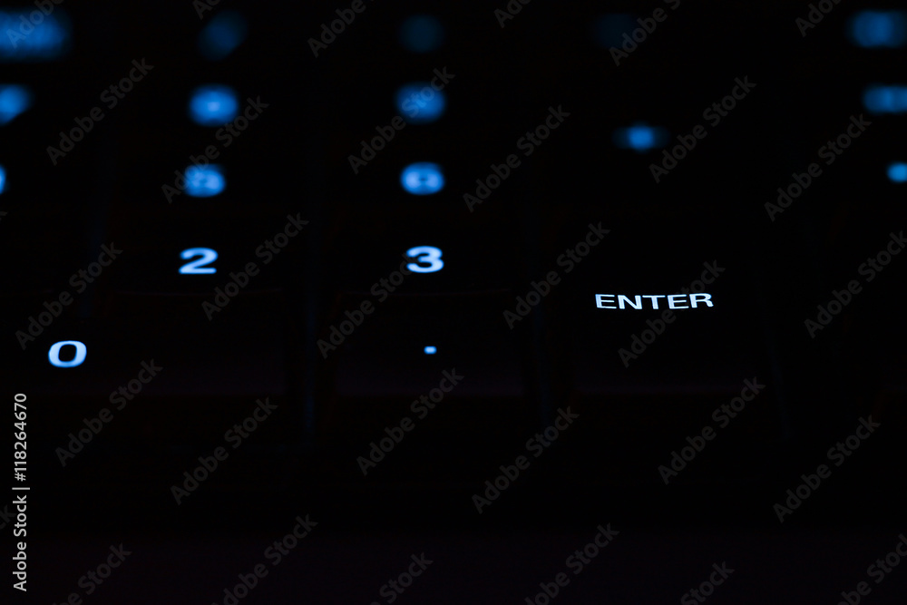 Part of modern black computer keyboard with enter button Part of modern black computer keyboard with enter button