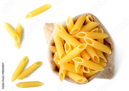 uncooked penne pasta in sack