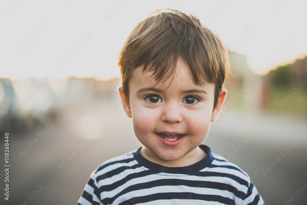 happy brunet kid smiling at camera happy brunet kid smiling at camera