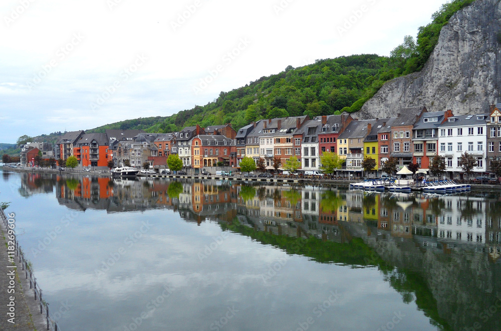 The Reflection of Colorful Traditional Architectures on the Meuse River in Dinant, Belgium