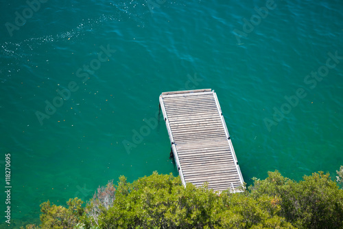 Small wooden pier on water © dvoevnore
