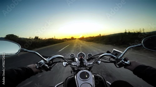 A motorcycle road adventure going forward to the sun in  photo