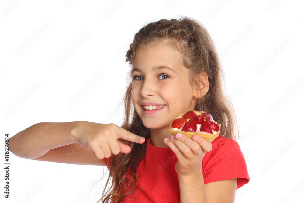 Little girl in a red dress shows a finger on a cake with strawberries isolated on white Little girl in a red dress shows a finger on a cake with strawberries isolated on white