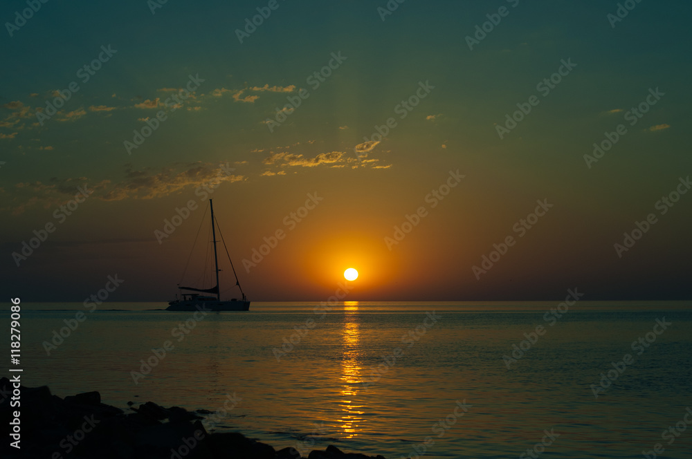 Fototapeta premium Summer sea sunset with sailboat