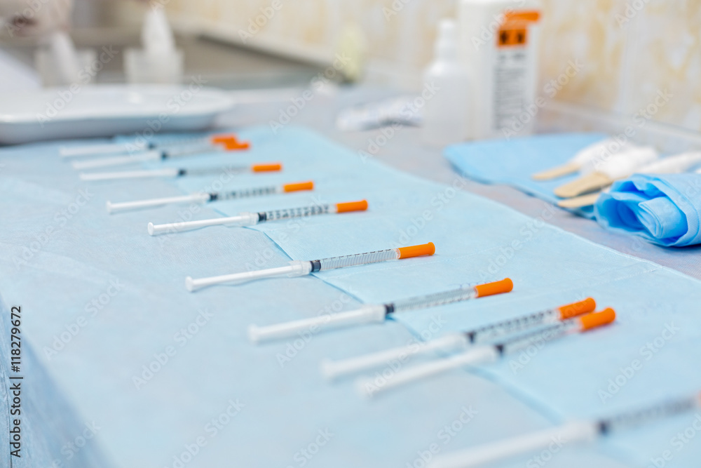 row of syringes with medicines row of syringes with medicines