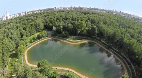 Aerial view pond among plants in park Sokolniki at summer sunny day.