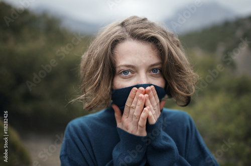 Caucasian woman wearing turtleneck sweater outdoors