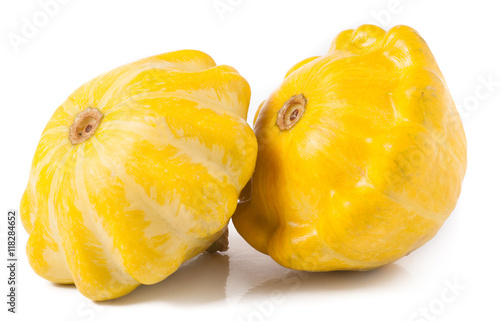 two yellow pattypan squash isolated on white background