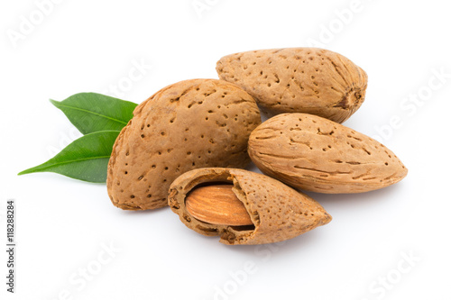 Almonds with leaves isolated on white background