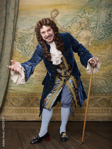 Actor dressed in old-fashioned costume on stage