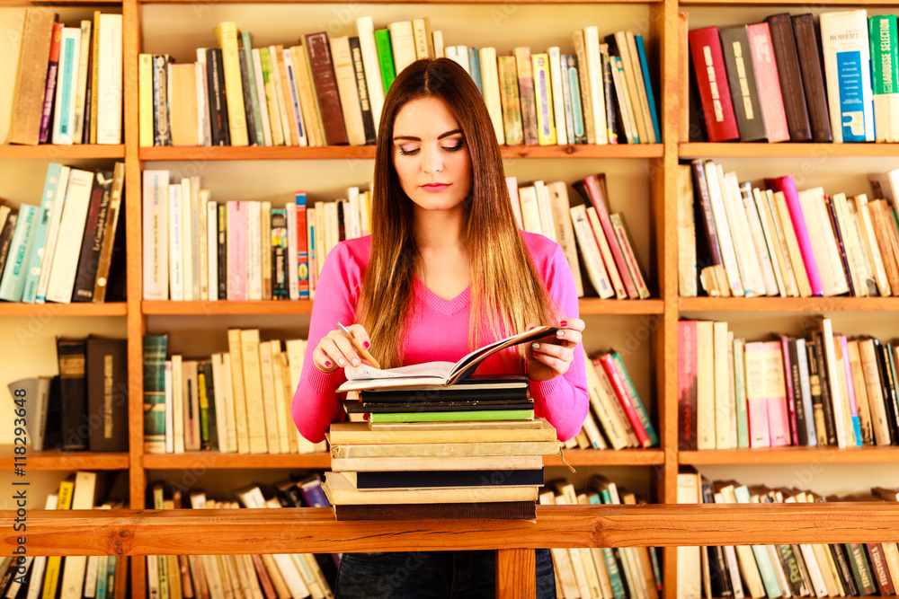 Girl student in college library Girl student in college library