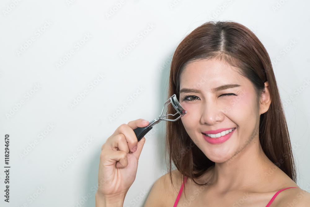 Woman Using Eyelash Curler