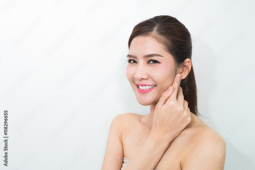 The Portrait of a beautiful female model on white background The Portrait of a beautiful female model on white background