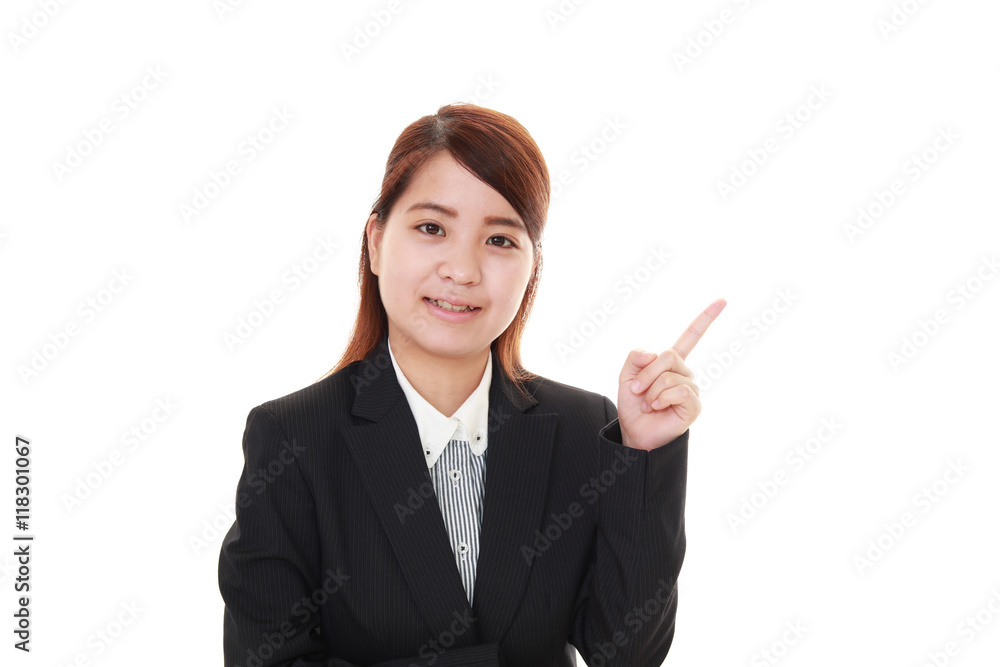 指示する笑顔のビジネスウーマン 指示する笑顔のビジネスウーマン