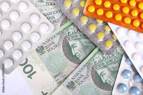 Zloty money bills and colorful pills