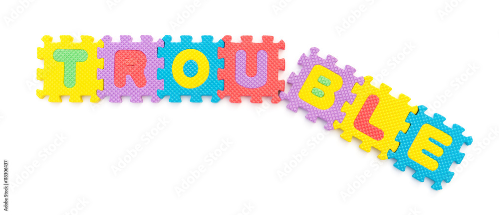 broken word of trouble made by jigsaw puzzles on white broken word of trouble made by jigsaw puzzles on white