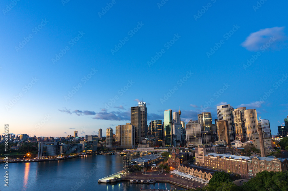 Aerial view of Sydney Central Business District skyscrapers on dusk. Urban landscape view from above. Circular Quay, Australia