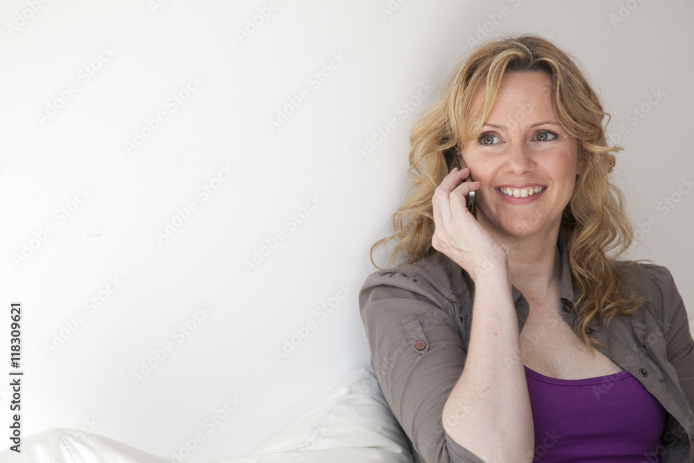Caucasian woman talking on cell phone Caucasian woman talking on cell phone