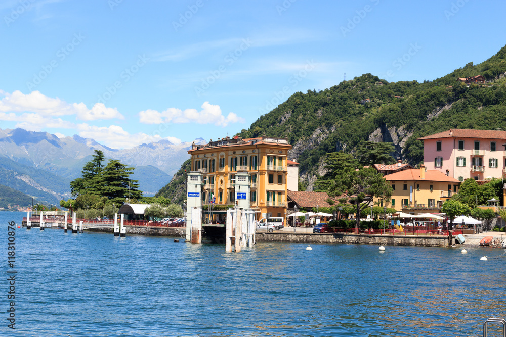 Ferry dock in village Varenna at Lake Como with mountains in Lombardy, Italy