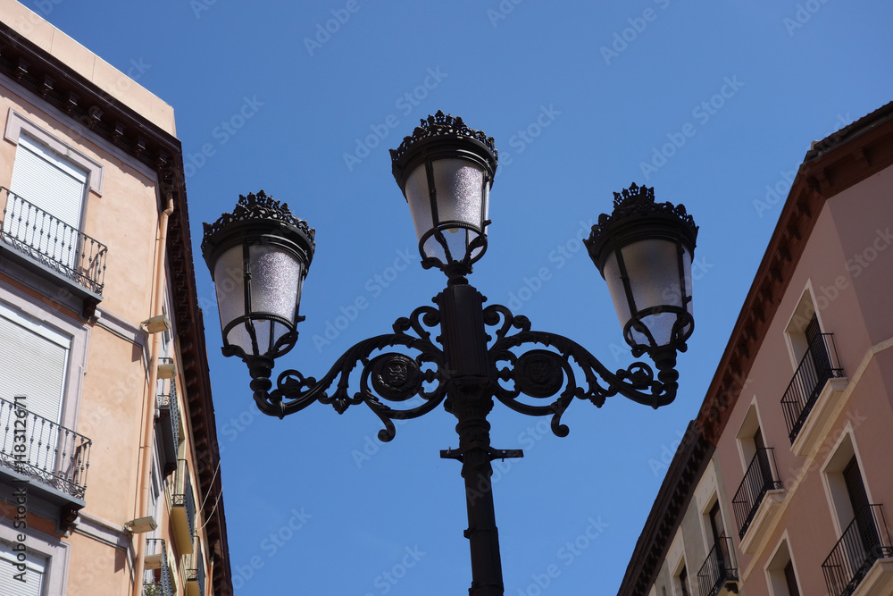 street light surrounded by buildings street light surrounded by buildings