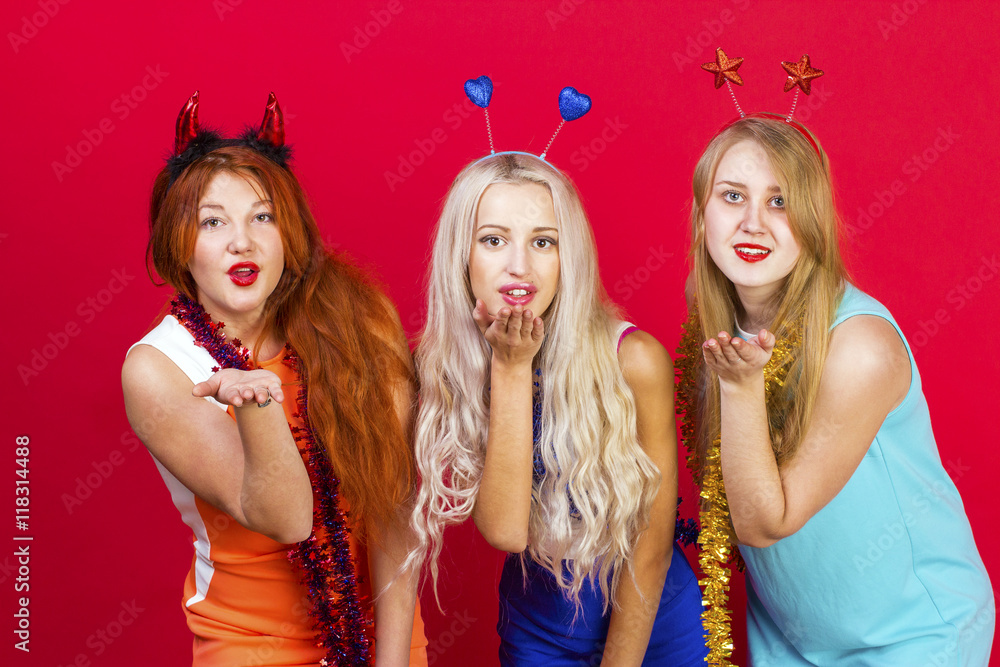 Obraz premium Young nice girls have fun on a christmas party