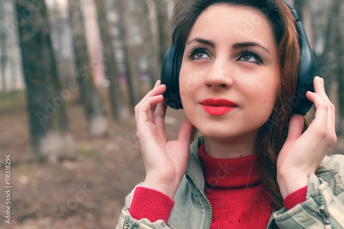 girl in park with headphone photo