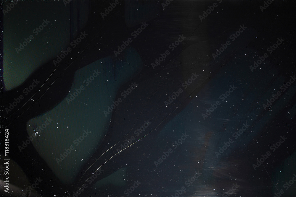 Old dusty black digital screen with cracks. Broken screen of smartphone