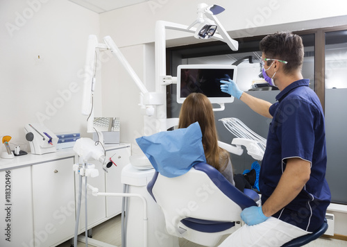 Dentist Showing Blank Screen To Female Patient