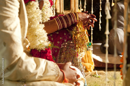 Couple in ornate, traditional Indian wedding clothing photo