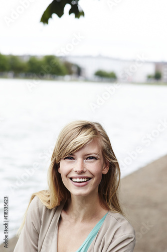 Stunning smile on blond woman at river, portrait © sanneberg