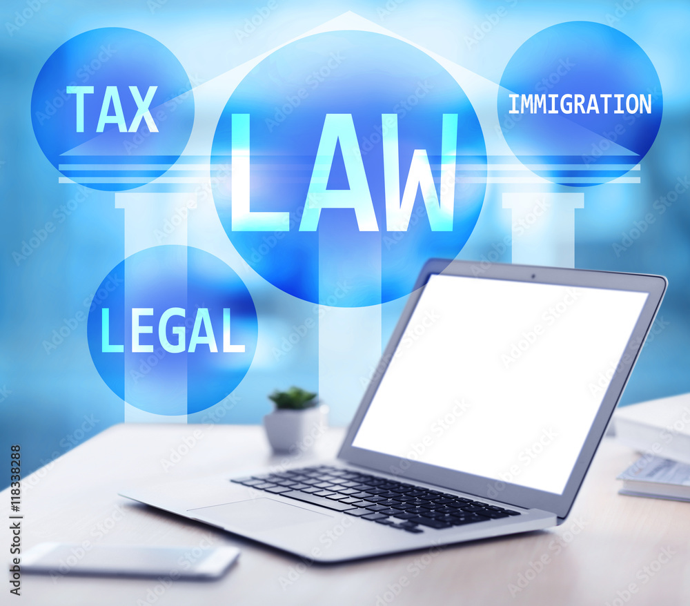 Law concept. Lawyer workplace with laptop and text design on blurred background. Blank laptop screen. Law concept. Lawyer workplace with laptop and text design on blurred background. Blank laptop screen.