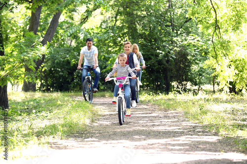 Happy family on bike ride i...
