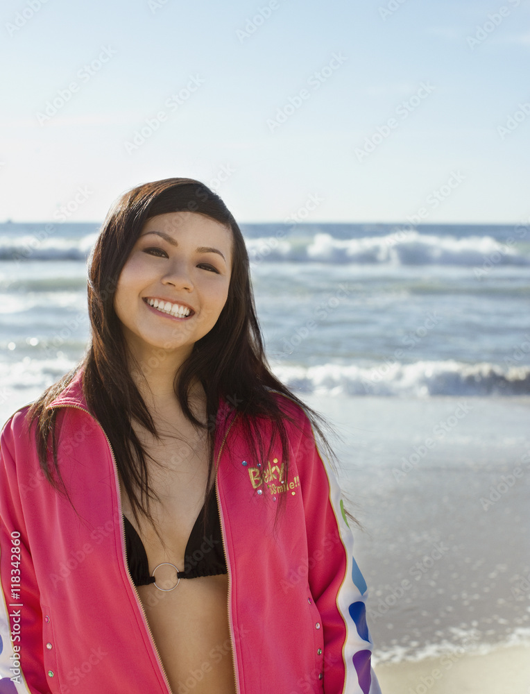 Asian woman in front of ocean Asian woman in front of ocean