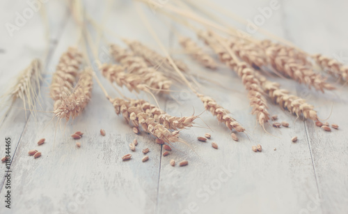 Ears of wheat on a wooden table