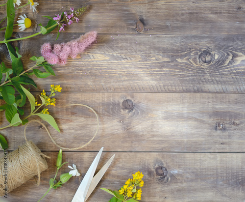 Flowers on wooden background. Top view