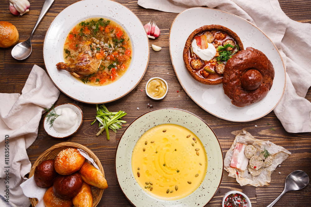 Assorted soups on the table, overhead view. Assorted soups on the table, overhead view.