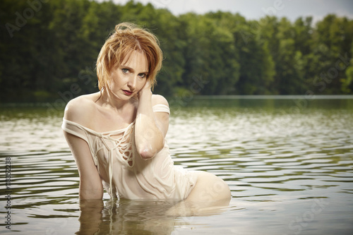Nice lady posing in summer water