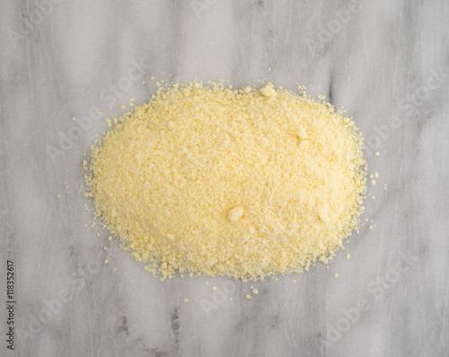 Εκτύπωση καμβά Grated Pecorino Romano cheese on a marble cutting board top view.