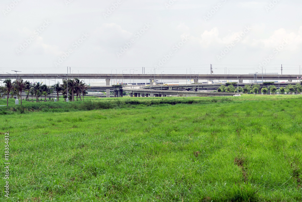 Highway or elevated expressway with a grass foreground in Bangkok Thailand. Highway or elevated expressway with a grass foreground in Bangkok Thailand.