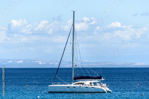 Sailboat yacht is moored in the sea bay. © _jure