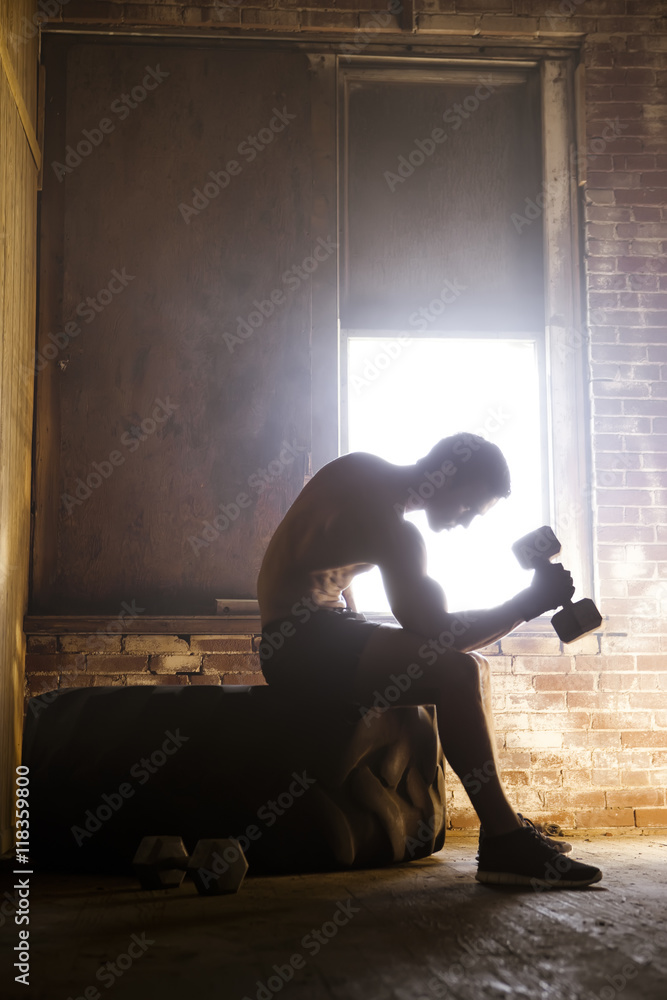 Caucasian man exercising with dumbbells Caucasian man exercising with dumbbells