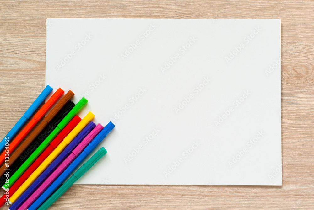Obraz premium Pencils, crayons and album sheet