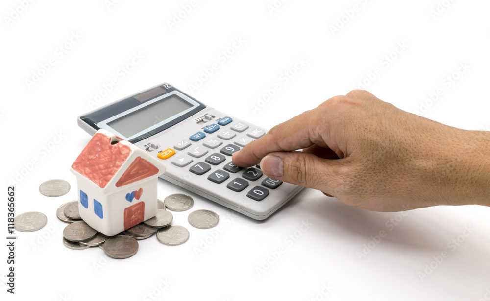 House and calculator and hand on white background House and calculator and hand on white background