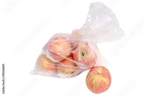 The heap of red apples packed in plastic film on white background © kedsirin