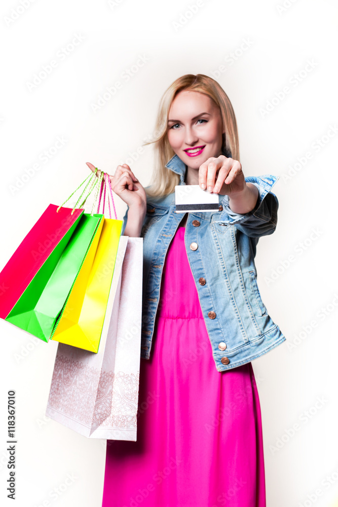Smiling girl with shopping bags. credit card in the hands Smiling girl with shopping bags. credit card in the hands