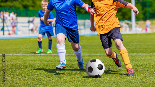 Fototapeta Naklejka Na Ścianę i Meble -  Children Playing Soccer Football Match. Sport Soccer Tournament for Youth Teams
