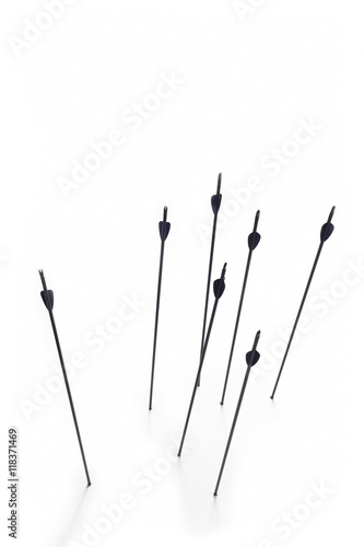 Arrows Hitting White Surface