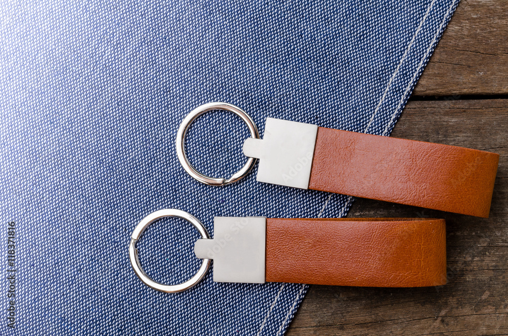 custom made wallpaper toronto digitalLeather key chain with blue fabric on wooden background