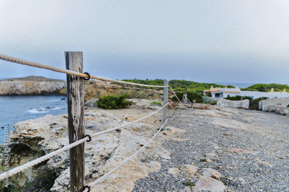 rickety fence on the rock cliff
ibiza,spain,summer