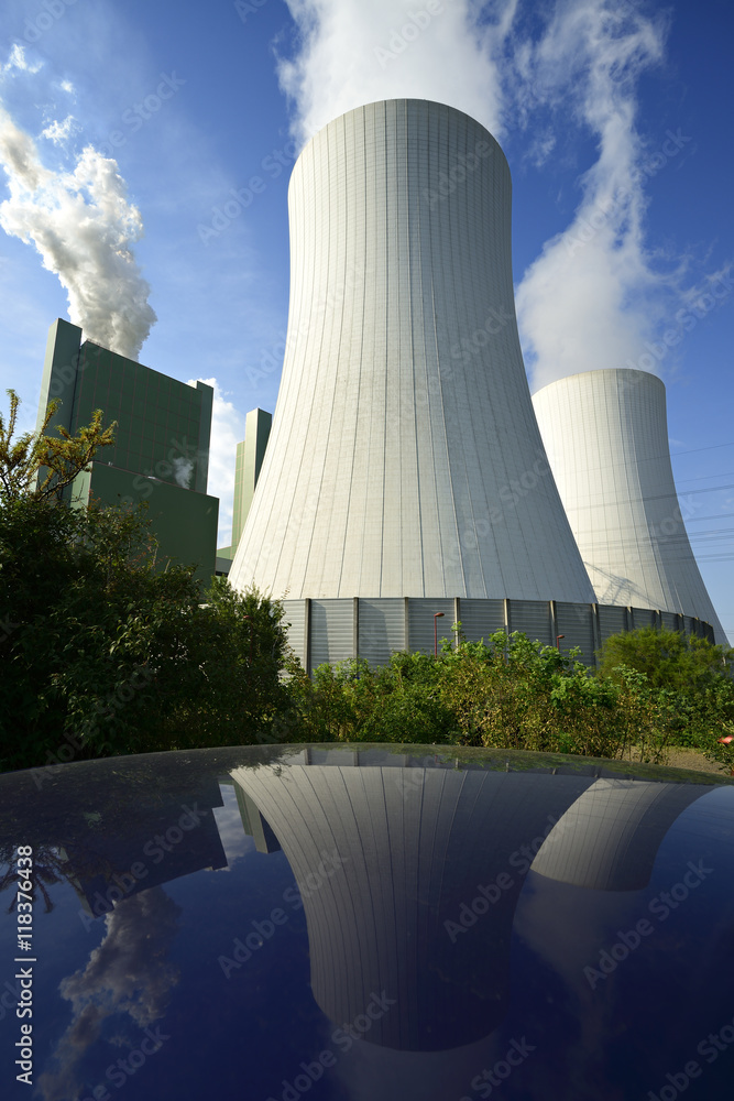 Coal Power Plant Smoking and Steaming against Blue Sky Coal Power Plant Smoking and Steaming against Blue Sky